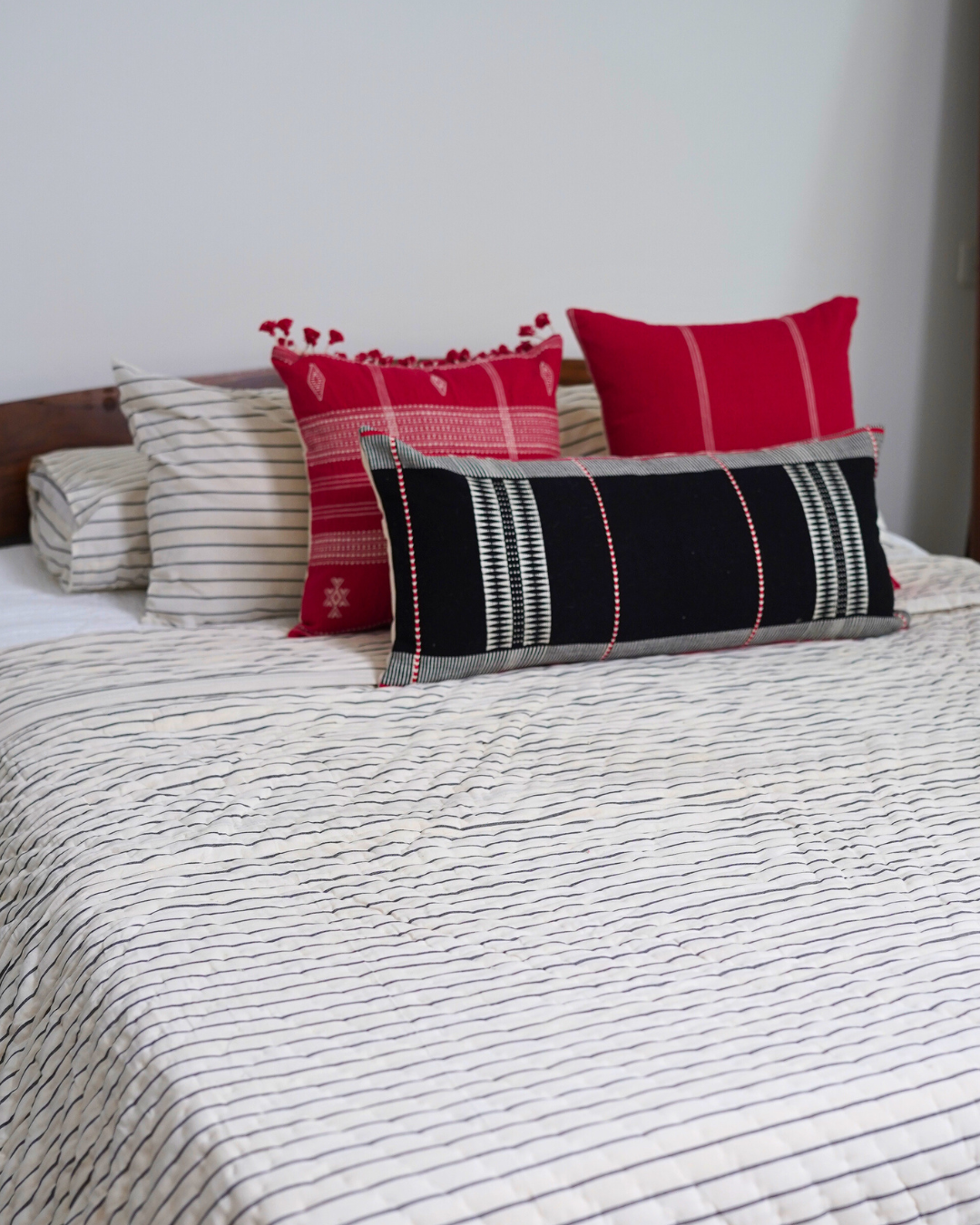 KIZIL HANDWOVEN LUMBAR - BLACK AND WHITE WITH RED EMBELLISHMENTS