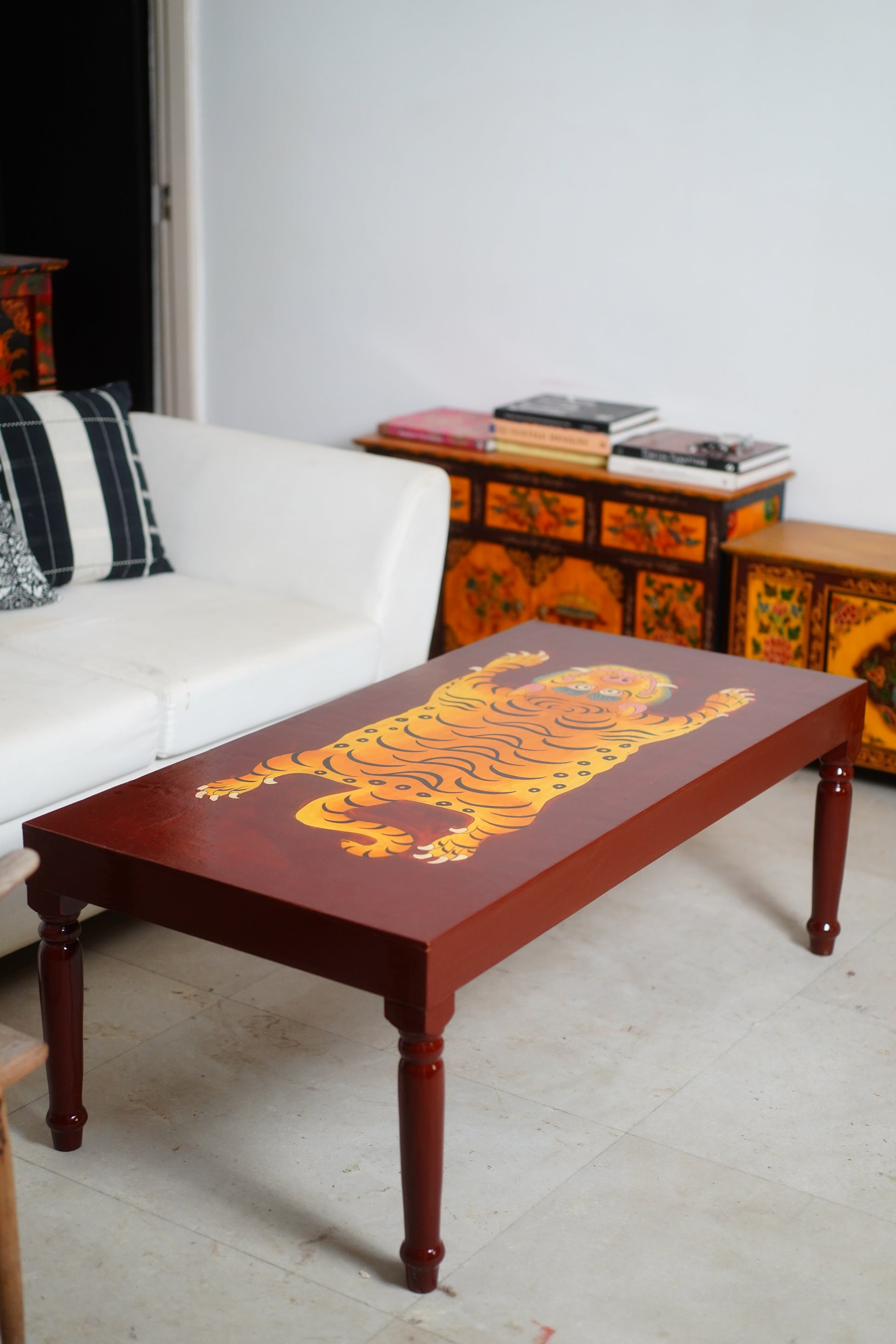 CHINWA HAND PAINTED COFFEE TABLE - BROWN AND RUST