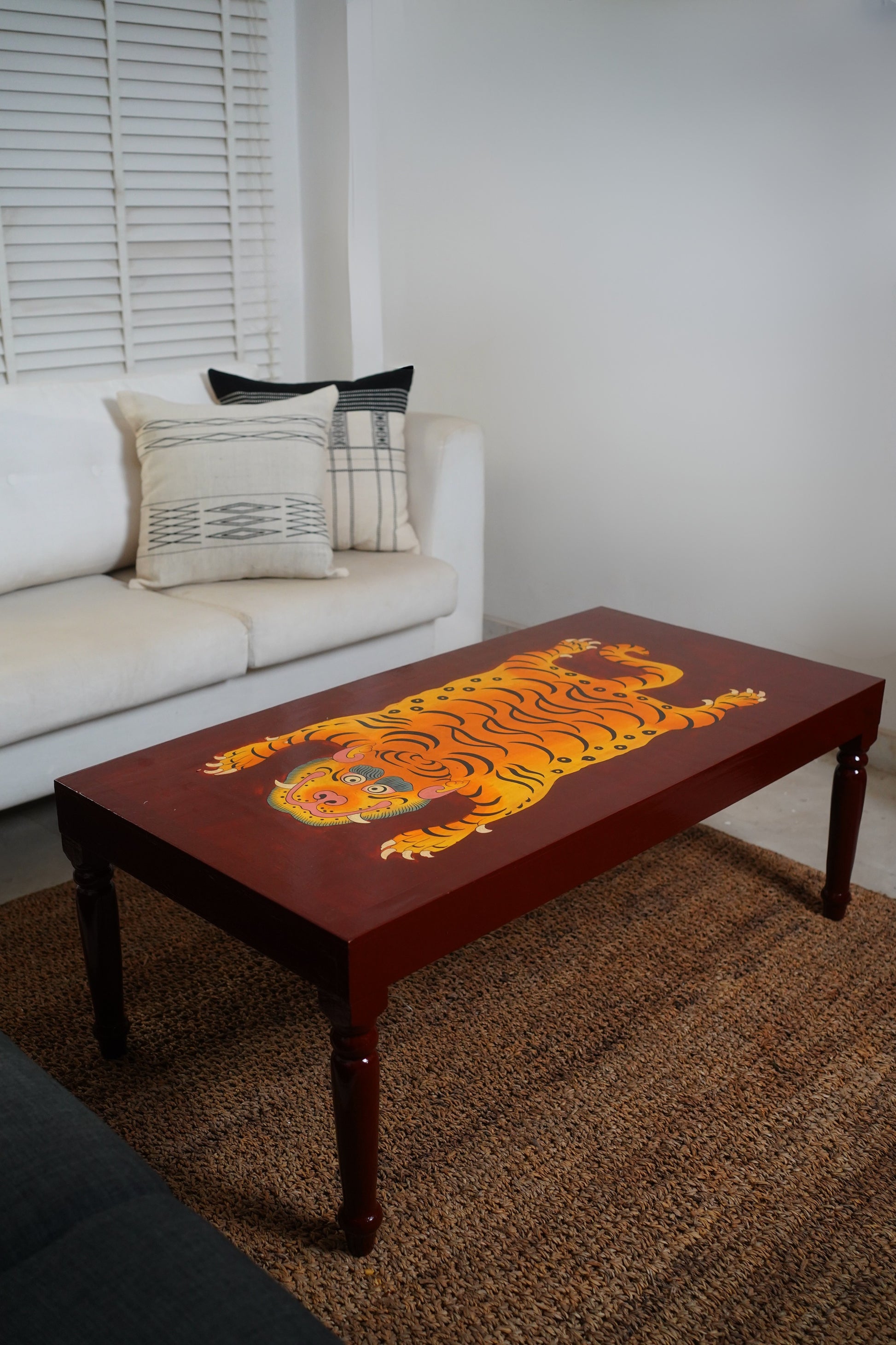 CHINWA HAND PAINTED COFFEE TABLE - BROWN AND RUST