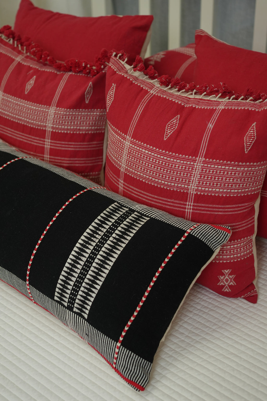 KIZIL HANDWOVEN LUMBAR - BLACK AND WHITE WITH RED EMBELLISHMENTS