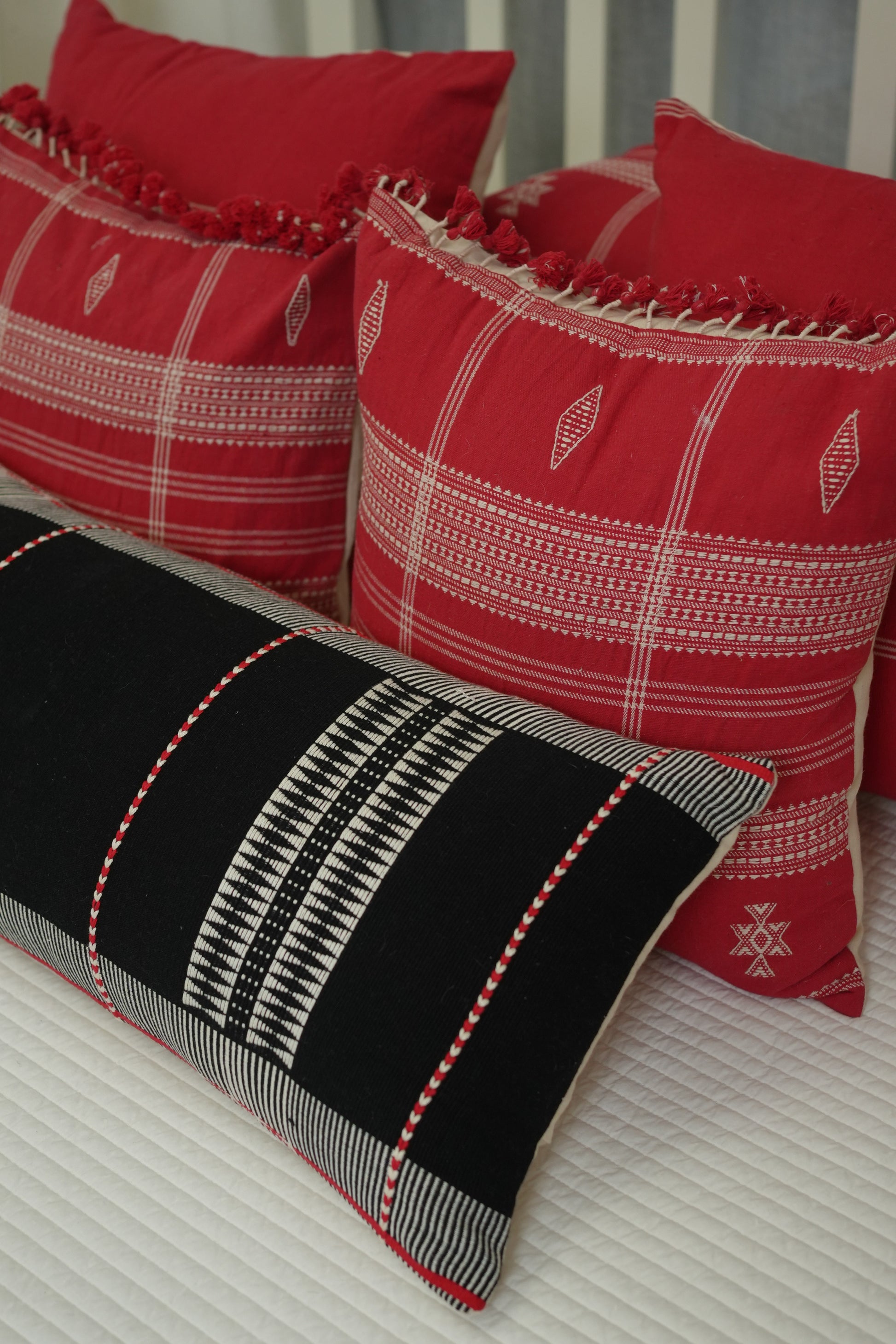 KIZIL HANDWOVEN LUMBAR - BLACK AND WHITE WITH RED EMBELLISHMENTS